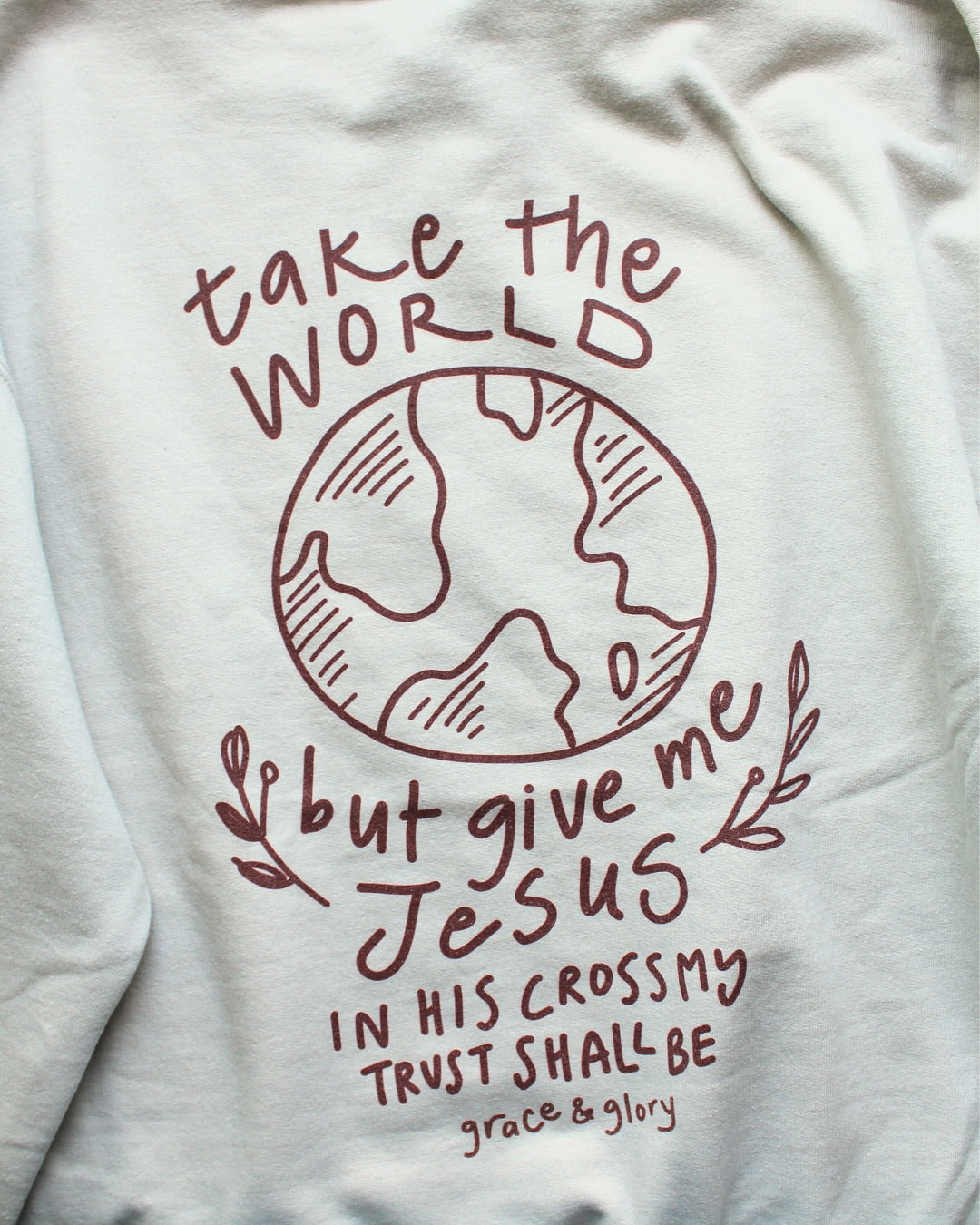 White sweatshirt with red text and graphic design on a white background